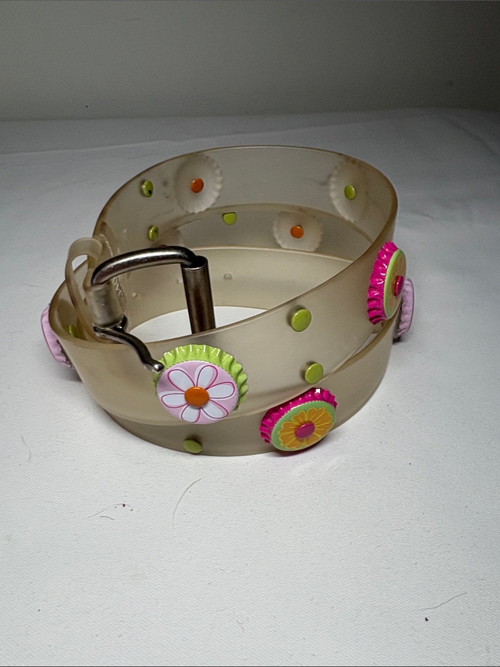 Unbranded Translucent Plastic Belt with Floral Bottlecap Studs. Size XL